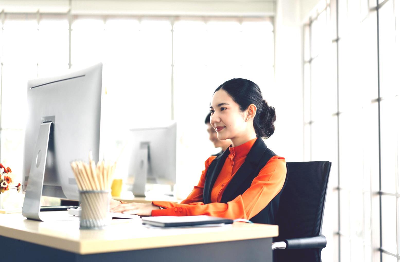 Graduate working on SEO campaign at modern workspace